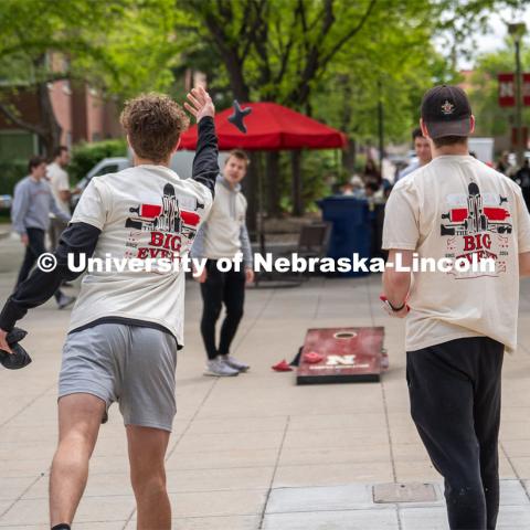 Max Booher (left) and Daniel Koland (right), members of Pi Kappa Alpha, play a game of corn hole at the lunch and gear check-out for the Big Event. May 4, 2024. Photo by Kirk Rangel for University Communication.